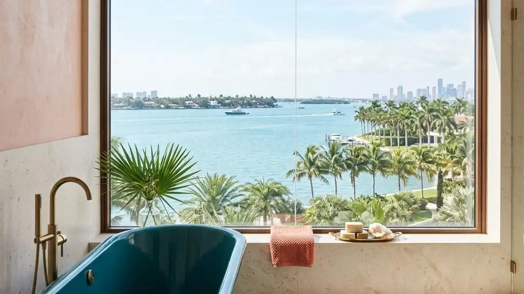 Bathroom window looking out over Biscayne Bay with palm trees